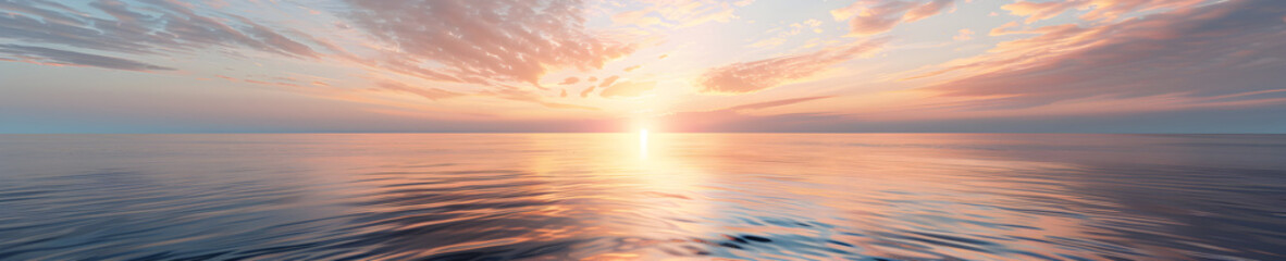 Beautiful sunset over the ocean with a clear sky and calm water.