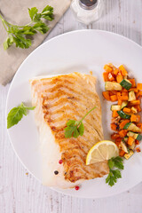 baked fillet of pollock or coalfish with vegetables