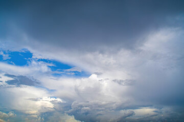 Background with a summer sky almost completely covered with white clouds. Bright sky in white tones.