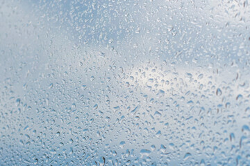 Background with wet glass. Drops of water on the window.