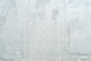Light background with water from fountains. Jets of water completely blocking the view.