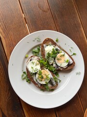 Sprat Sandwich served on a plate- traditional Latvian cuisine appetizer