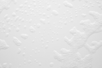 Abstract white soap foam bubbles texture on white background