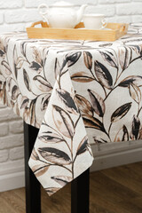 White Tablecloth With Brown Leaf Pattern Close Up