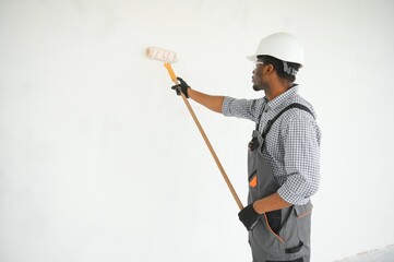painter man painting the wall, with paint roller