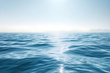 Obraz premium Calm blue ocean with gentle waves under a bright, clear sky. The smooth water surface creates a serene and tranquil atmosphere