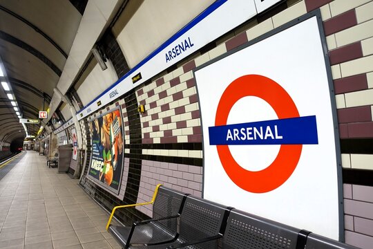 Arsenal London Underground tube station roundel sign on platform