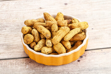 Raw ripe unpeeled peanut heap