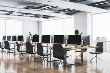 Modern bright coworking office interior with wooden flooring, panoramic windows and city view, furniture and equipment. 3D Rendering.