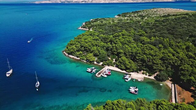 Aerial top view of beautiful island bay with yachts and crystal turquoise sea. Island Sveti Grgur, Croatia, Adriatic Sea 