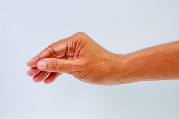 A southeast asian men showing picking something hand gesture isolated on white background