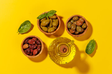 An assortment of various olives presented in a bowl, showcasing different colors, textures, and flavors