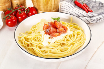 Pasta spaghetti with salmon and stracciatella