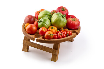 Fresh rustic tomatoes, isolated on white background.