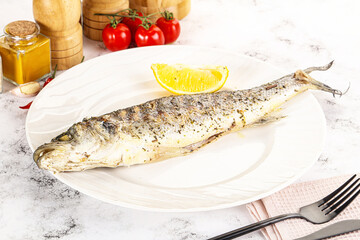 Grilled sea bass fish served lemon