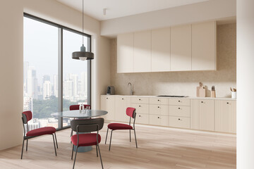 Stylish home kitchen interior with dining table, cabinet and panoramic window