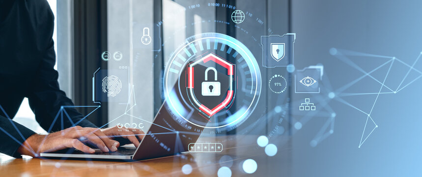 Cybersecurity concept with person typing on laptop and digital lock icons.