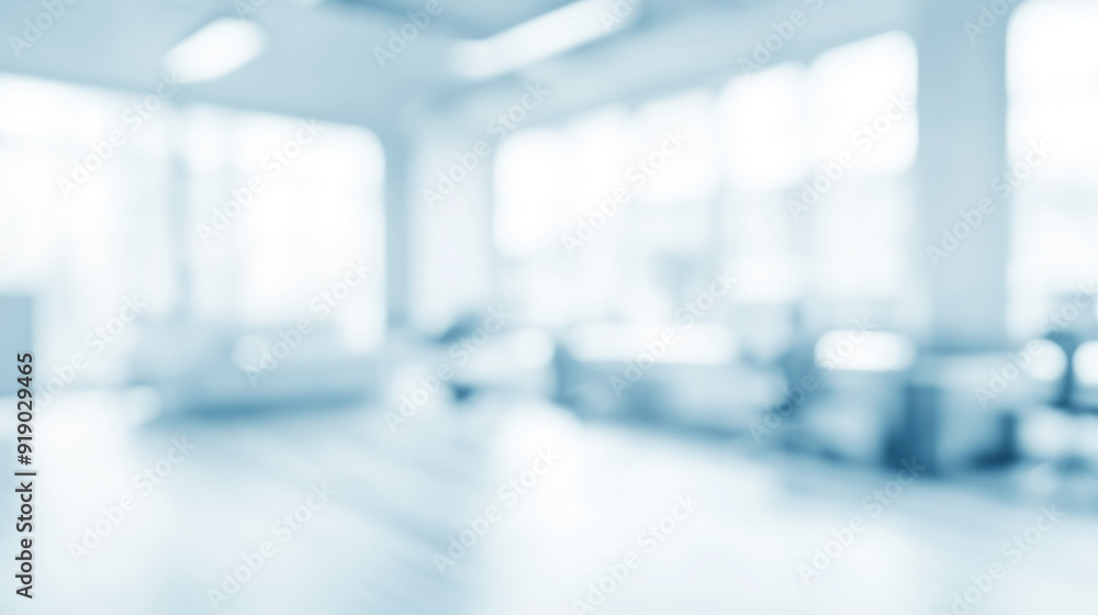 Poster a modern office space with abundant natural light, showcasing a blurred background effect with desks