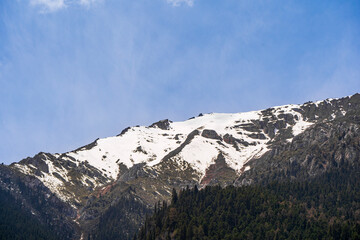 Snowy mountain peak in Jiuzhaigou National Park, China