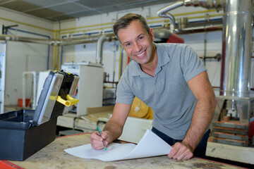 man looking at camera while working in studio
