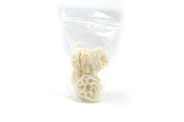 White crackers, in a plastic bag, isolated on white background