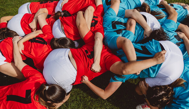 Rugby players in scrum having match on sports field