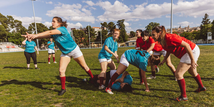 Rugby team playing match on field