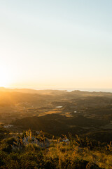 Mountains and plantations against endless ocean in countryside