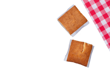 Sobaos pasiegos on an old wooden table seen from the side