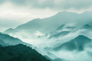 A scenic view of a mountain range shrouded in fog, great for use as a background or atmospheric image