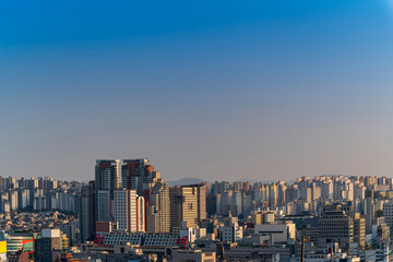 Seoul cityscapes, skyline, high rise office buildings and skyscrapers with blue sky and cloud in Seoul city, South Korea