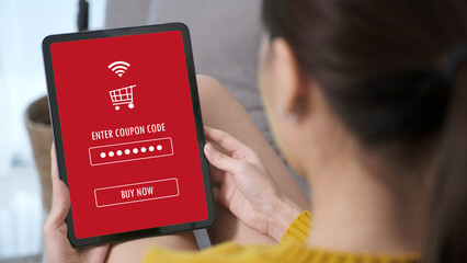 Hand typing discount coupon code on laptop screen to get the shopping on line cyber monday promotion, on line shopping ,digital marketing business and technology, lifestyle concept