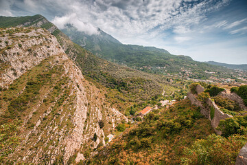 Ancient fortress ruins in Bar, Montenegro, perched on rugged mountains.