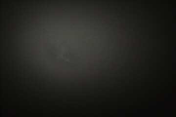 マットグレーの滑らかなプラスチックの表面に細かい質感があり、右側にビネットが付いています。絶妙なテクスチャ背景、柔らかい空白の背景	