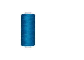 blue spool of sewing thread isolated on white background close up