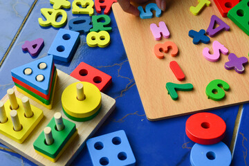 Set of different children's toys on a colored background top view. A place to insert text,...