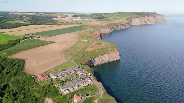 Aerial drone wide-angle footage of Cowbar village in North Yorkshire in summer
