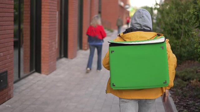 Late courier man carry package. Quick guy run city street deliver box. Green backpack mockup. Fast food delivery service job. Person with thermal store bag. Express home order. Rush worker boy hurry.