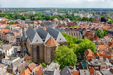 Naklejka premium Zwolle, The Netherlands, August 8, 2024: aerial view of the old town with Saint Michael's Church and the modern town hall