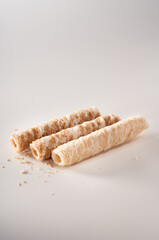 Crispy and delicious coconut crispy egg roll snack close up on white background