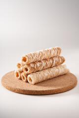 Crispy and delicious coconut crispy egg roll snack close up on white background