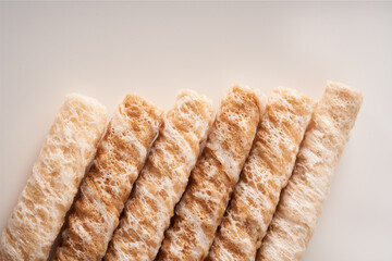 Crispy and delicious coconut crispy egg roll snack close up on white background