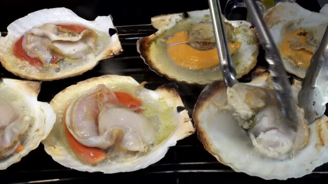Cooking grill japanese hotate scallop hokkaido style street food seafood juicy clam
