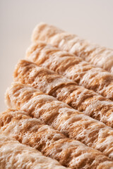 Crispy and delicious coconut crispy egg roll snack close up on white background