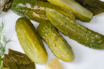 Pickled cucumbers among the some spices for pickling close-up