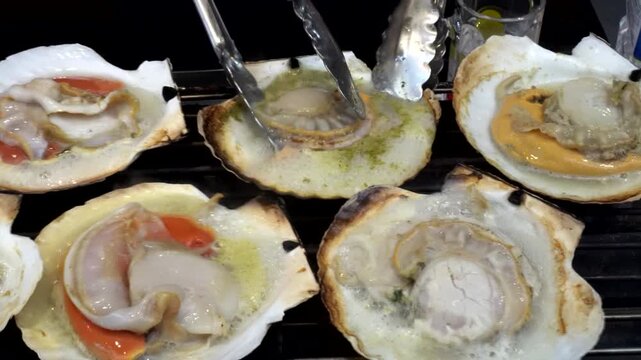 Cooking grill japanese hotate scallop hokkaido style street food seafood juicy sweet clam 4k