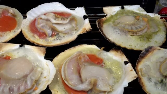 Cooking grill japanese hotate scallop hokkaido style street food seafood juicy sweet clam