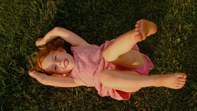 the child lies on the grass. Selective focus.