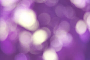 Purple bokeh abstract, pattern of blurred bright light in natural background.