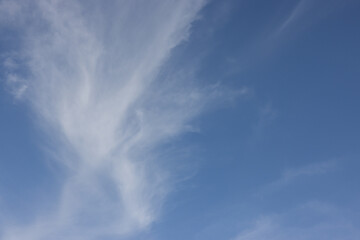 Fototapeta premium The sky is blue and clear with a few clouds scattered throughout